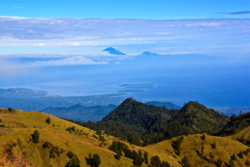 The 3 famous Gilis appear before Bali's volcano on the horizon The 3 famous Gilis appear before Bali's volcano on the horizon