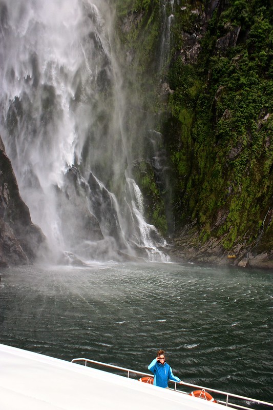 Lina in front of a Milford Sound waterfall Lina in front of a Milford Sound waterfall