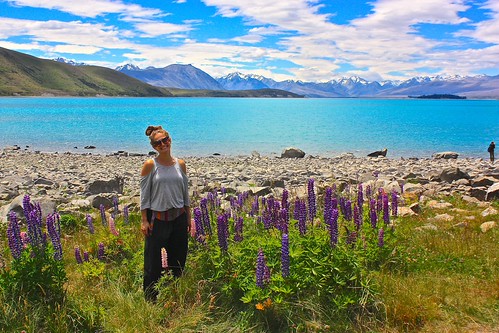 Lina with Lupine flowers in front of Lake Tekapo