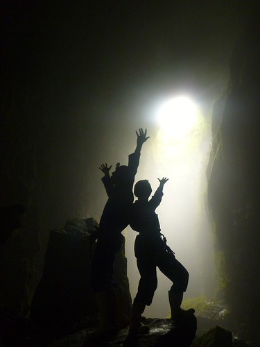 striking a pose inside the "Lost World" cave