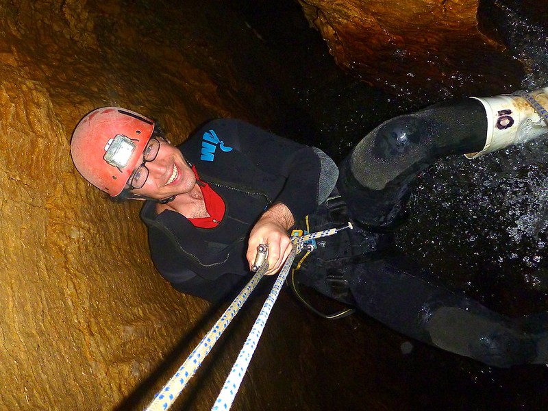 rappelling down a waterfall in a cave at Haggas Honking Holes rappelling down a waterfall in a cave at Haggas Honking Holes