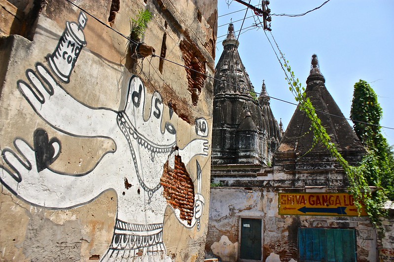 worn graffiti in front of a worn temple worn graffiti in front of a worn temple