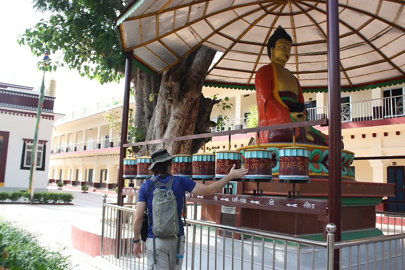 spinning the prayer wheels in a Tibetan monastery
