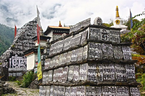 Buddhist mantras written all over these tablets next to a small Gompa