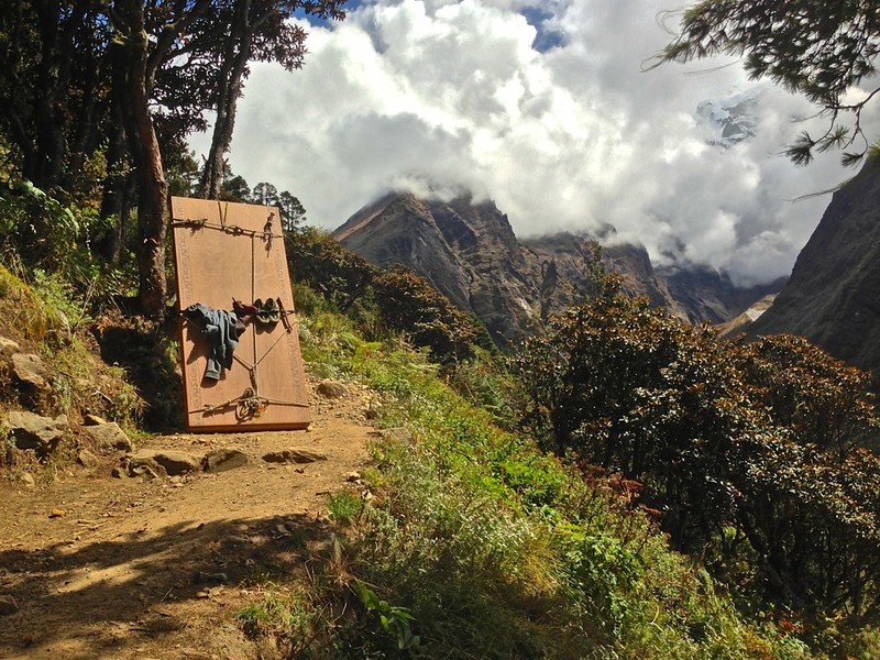 This sherpa is carrying huge planks of wood