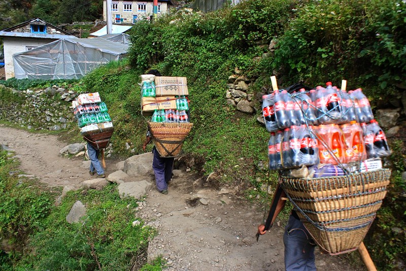 Porters pack up soda for peak season. The delivery charge is included in the cost of your food Porters pack up soda for peak season. The delivery charge is included in the cost of your food