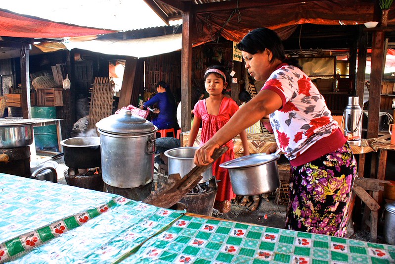 Making lunch over special wood stoves at the market in Nyaungshwe, Myanmar Making lunch over special wood stoves at the market in Nyaungshwe, Myanmar