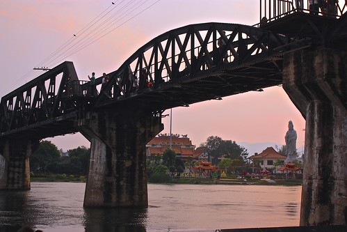 undershot of the bridge over River Kwai, monastery in the background