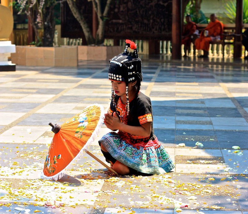 a young Hmong girl performing in front of Wat Phra That Doi Suthep a young Hmong girl performing in front of Wat Phra That Doi Suthep