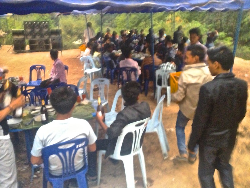 The dance floor cleared as a young man brings another crate of Beer Lao
