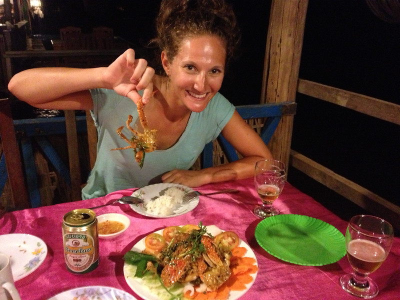 eating fresh crab topped with amazing kampot green pepper corn sauce in Kep, Cambodia eating fresh crab topped with amazing kampot green pepper corn sauce in Kep, Cambodia