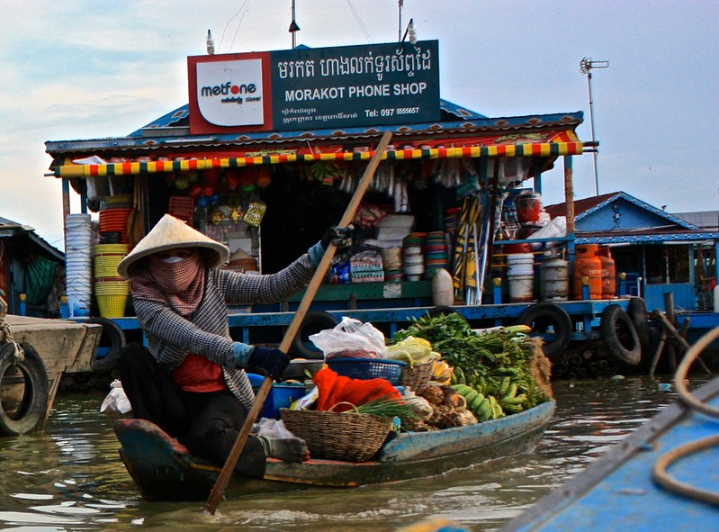 yet another phone shop, and a lady with lots of fruits and veggies. for sale?
