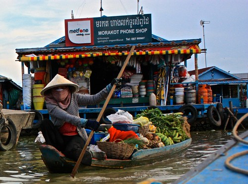yet another phone shop, and a lady with lots of fruits and veggies. for sale?