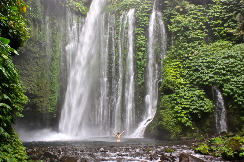 standing under one of the waterfalls outside of Senaru, Lombok standing under one of the waterfalls outside of Senaru, Lombok