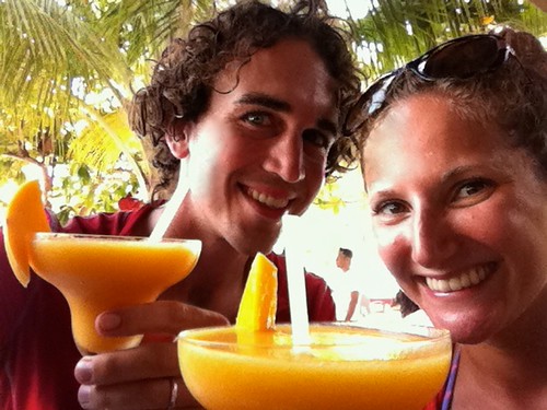 Enjoying fresh mango and rum cocktails Enjoying fresh mango and rum cocktails