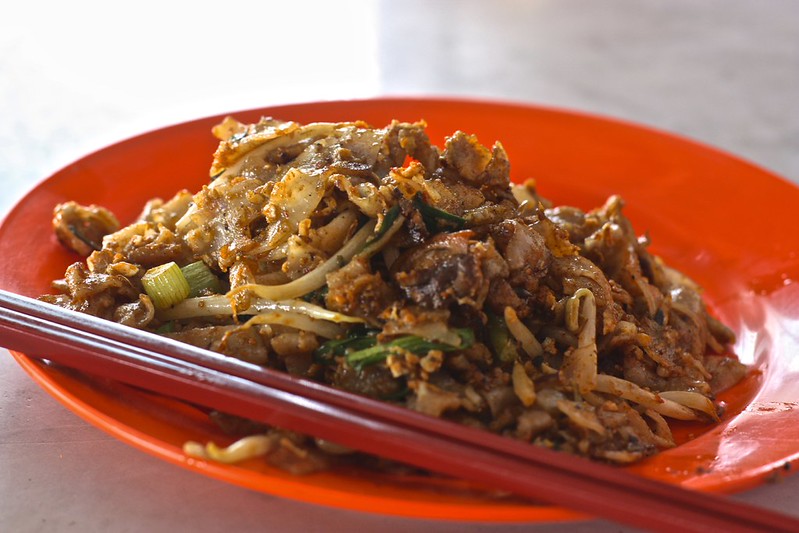 char kway teow… wide noodles with egg, pork, and shrimp. And vegetables… char kway teow… wide noodles with egg, pork, and shrimp. And vegetables…